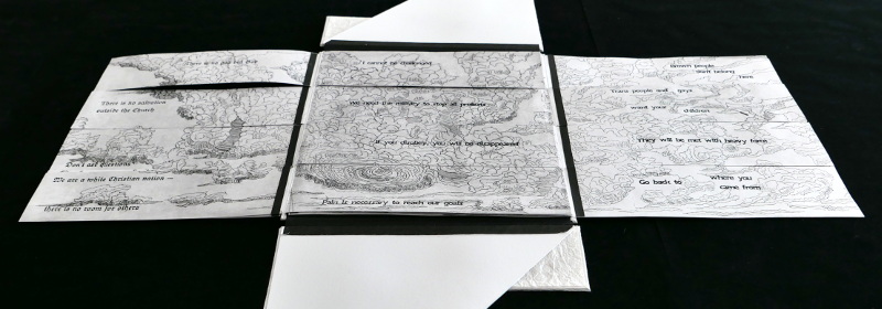 Book open to title page with front end paper