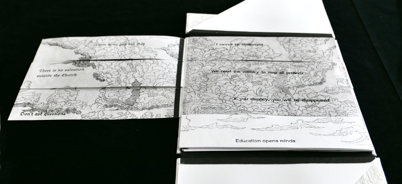 Book open to title page with front end paper